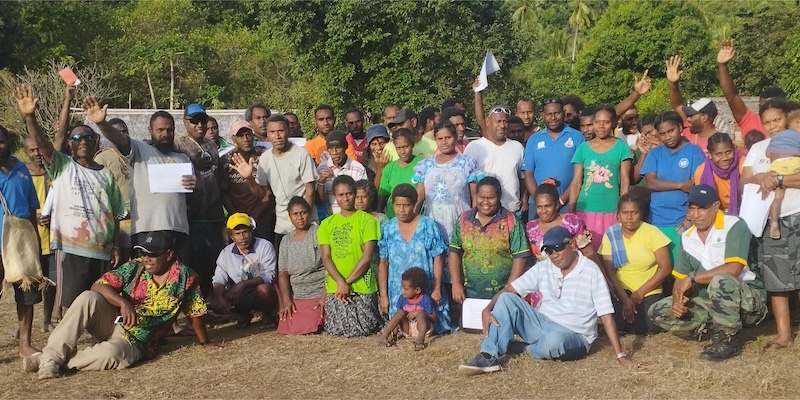 Participants of the Chiefs Summit in Vanuatu pose together after the community event.