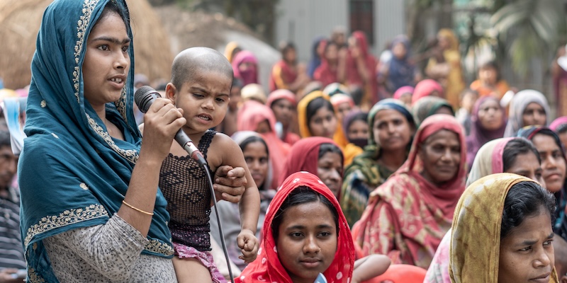 A woman speaks at a training organized by Footsteps Bangladesh